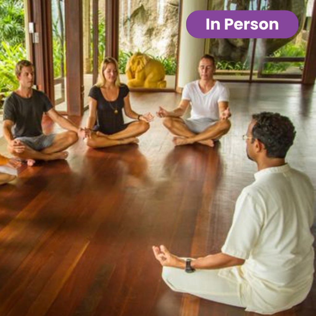 group of people both men and women along with mentor performing meditation at mindfulness studio