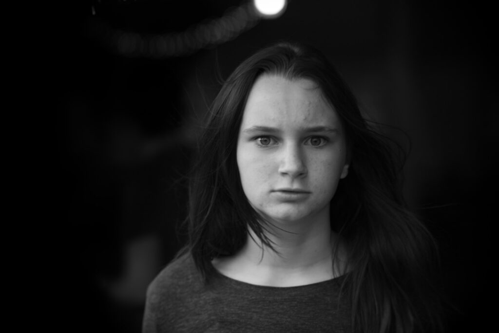 a black and white photo of a young woman