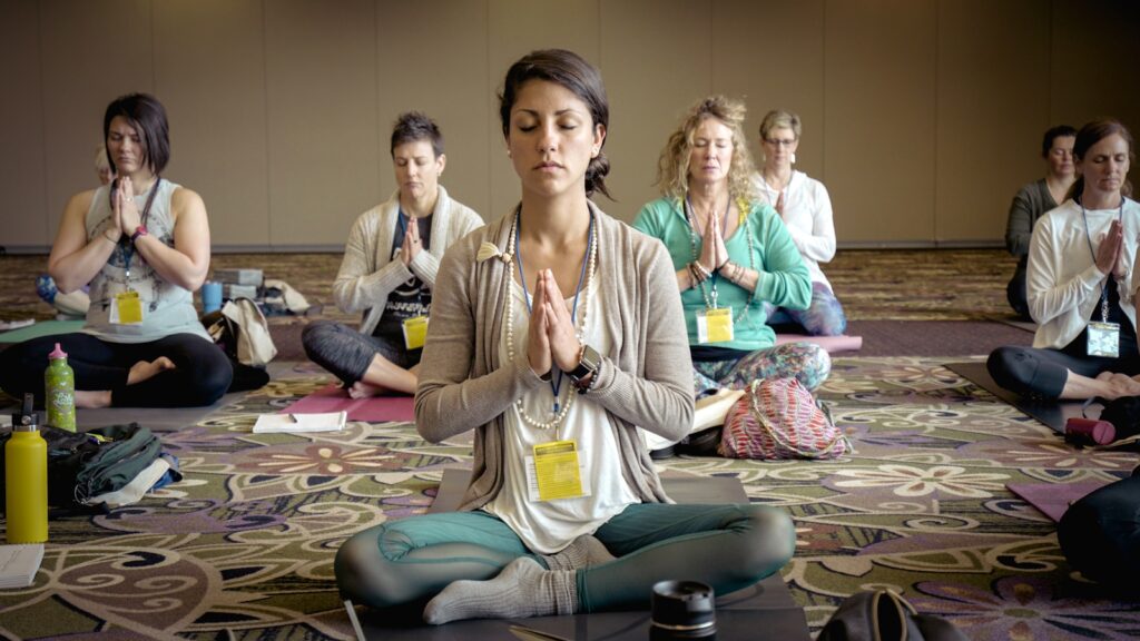 group of people doing group meditation at mindfulness Meditation studio.